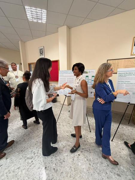 Ms. Mercy Larbi, engaging some participants during her poster presentation